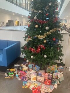 image of christmas tree with gifts underneath